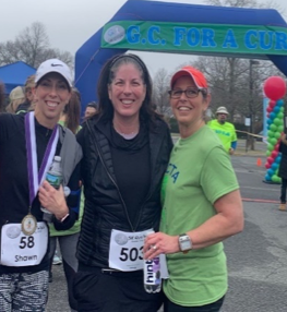 Danielle Gaudio-Lalehzar at the finish line of the GC For a Cure 5K with friends