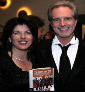 Bob Gaudio with his daughter Danielle holding Jersey Boys program